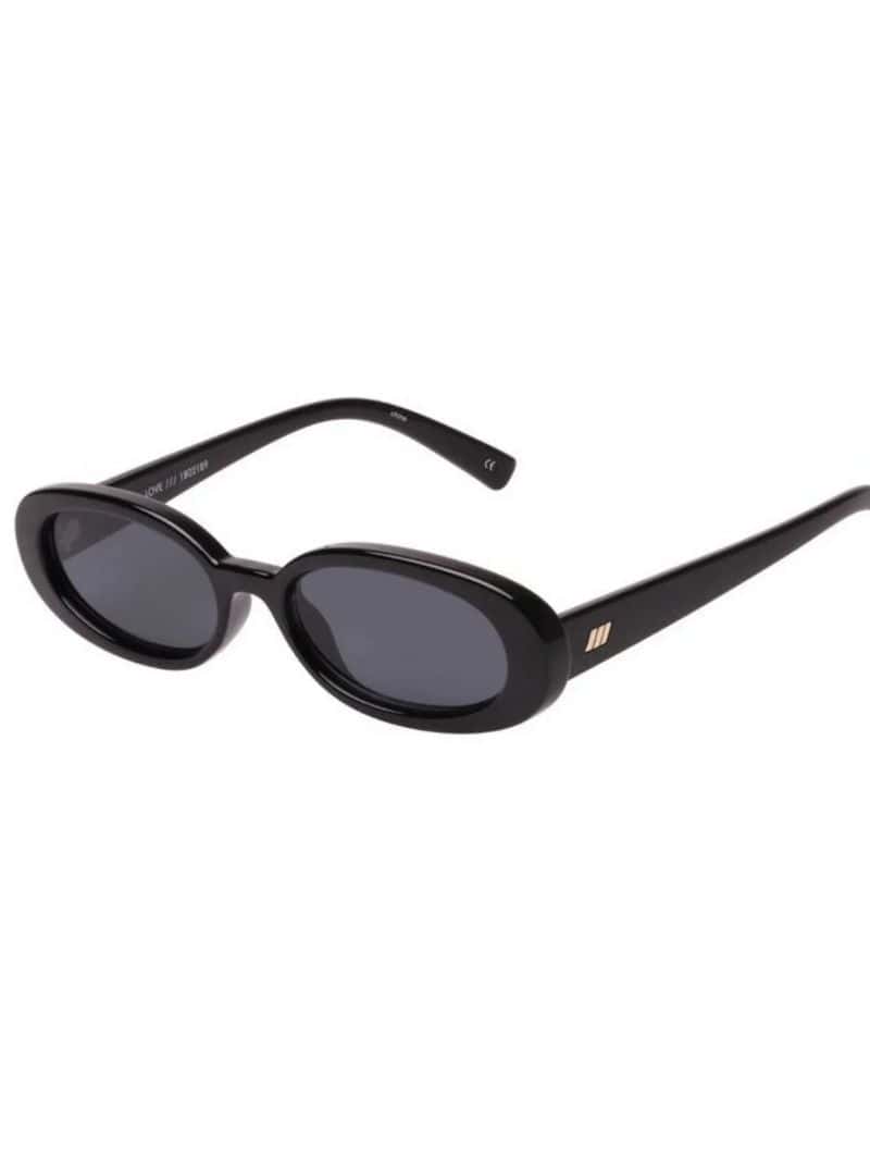 A pair of sunglasses with black frames and dark lenses.