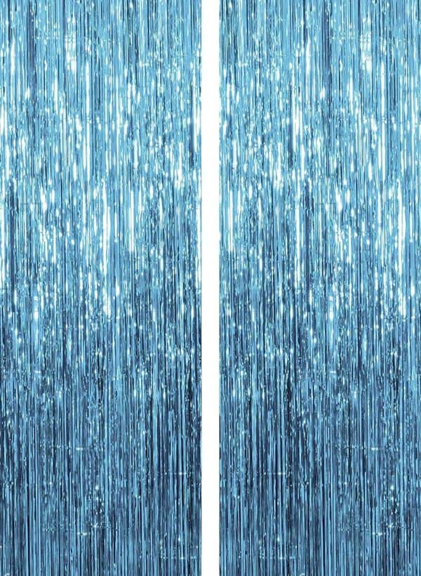 A close up of two blue curtains with white lines