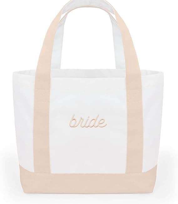 A white and beige tote bag with the word bride written on it.