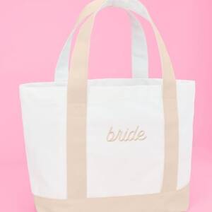 A white and beige bag with the word bride written on it.