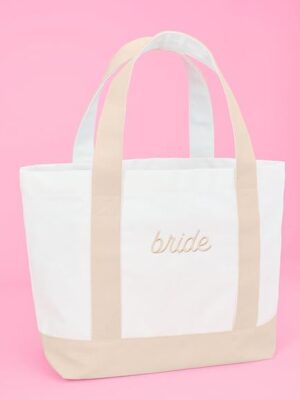 512xXnrnLL._AC_SX466_.jpg A white and beige bag with the word bride written on it.