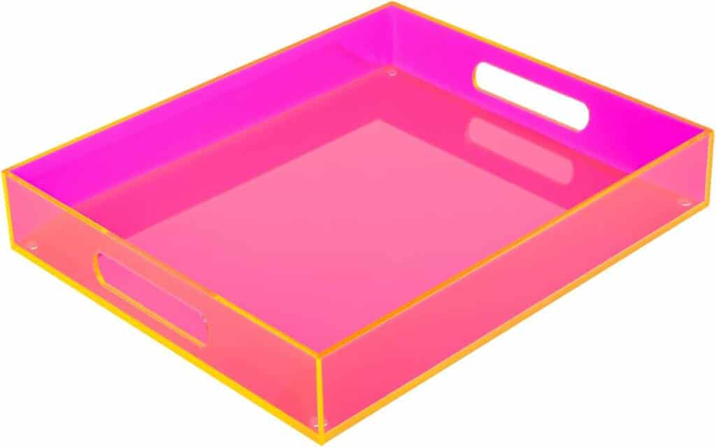 A pink tray with yellow trim and handles.