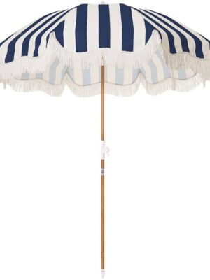 A blue and white umbrella with a wooden pole.