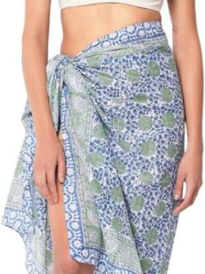 A woman wearing a blue and green floral sarong.