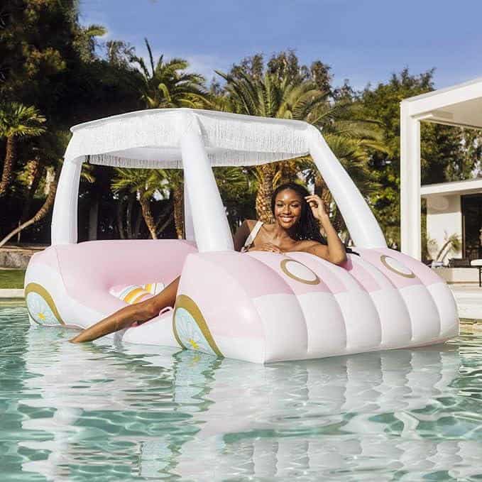 A woman sitting on top of an inflatable boat.