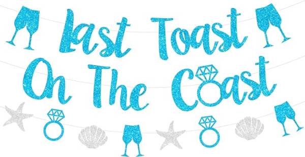 A banner that says toast the coast with blue glitter.