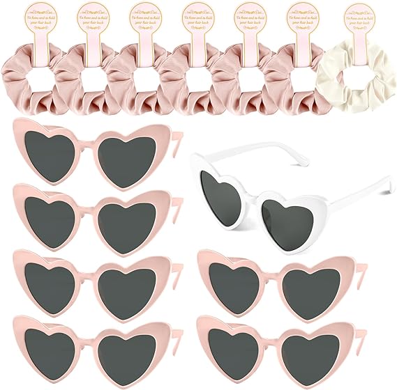 A set of sunglasses and hair clips with pink hearts.