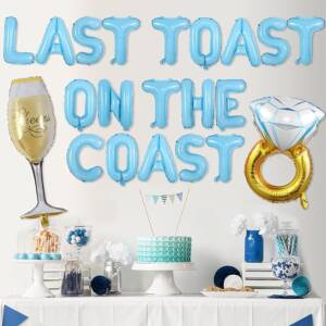 A table with balloons that say " last toast on the coast ".