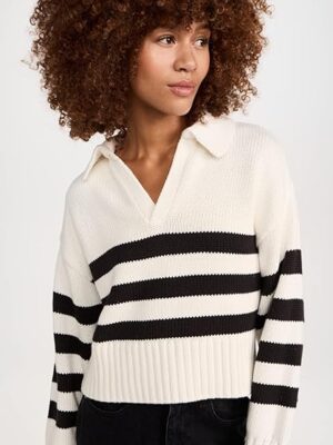 71yvZt-73BL._AC_SY741_.jpg A woman wearing a black and white striped sweater.