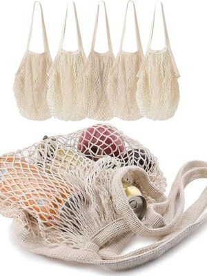 A group of six bags with fruit inside.