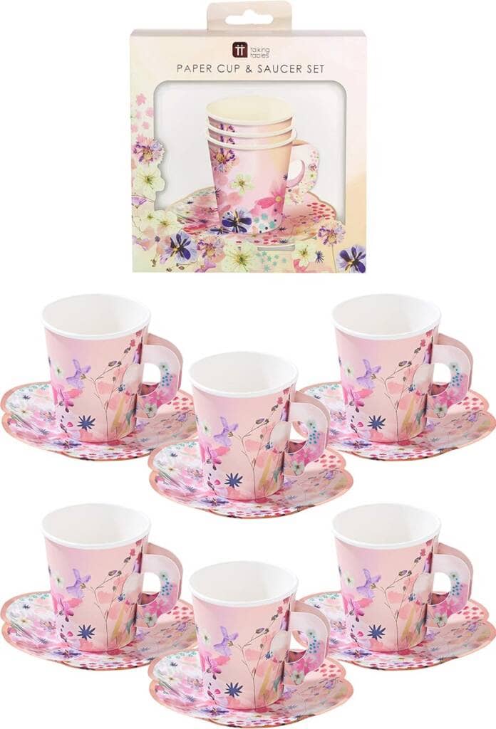 A set of six cups and saucers with pink flowers.