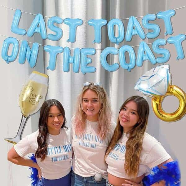 Three Girls Posing For A Picture With The Words &Quot; Last Toast On The Coast &Quot;.