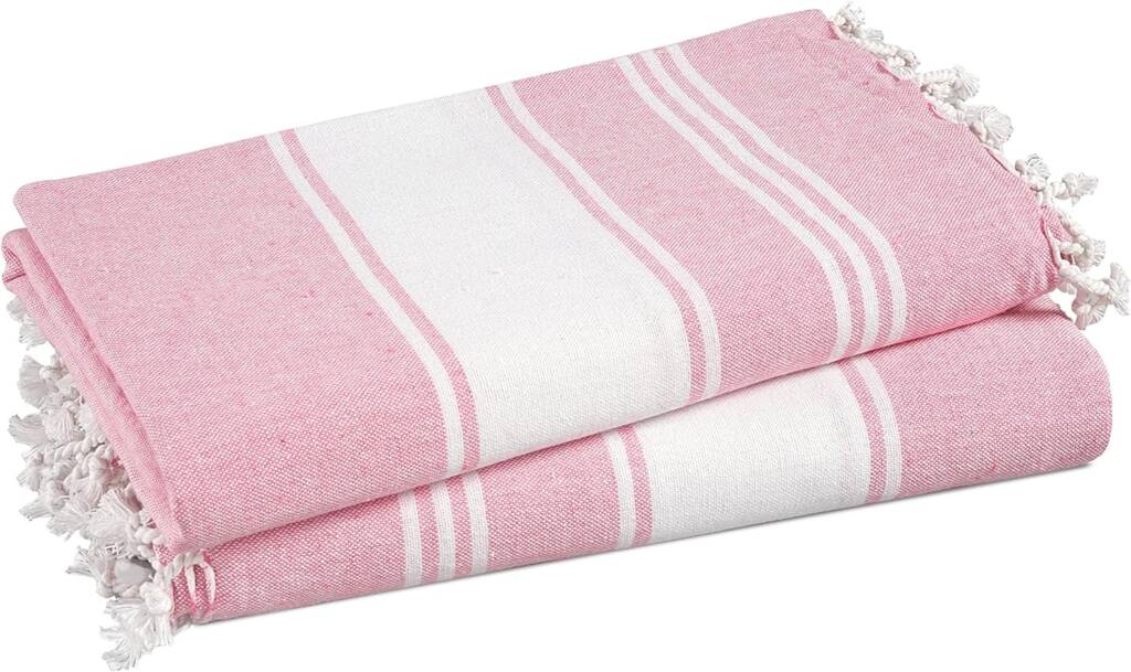 A pair of pink and white towels on top of each other.