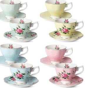 A set of six cups and saucers with roses.