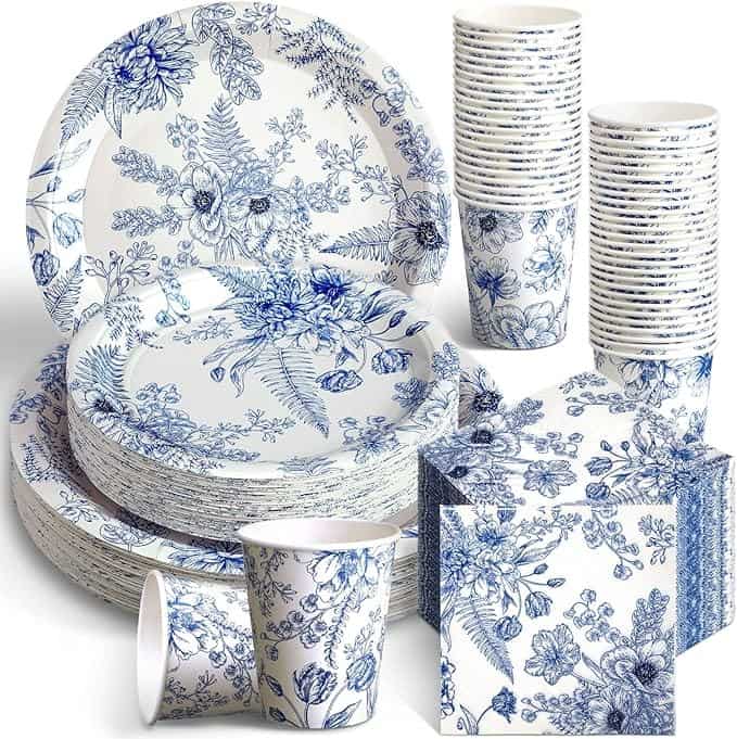 A set of blue and white plates, cups, and napkins.
