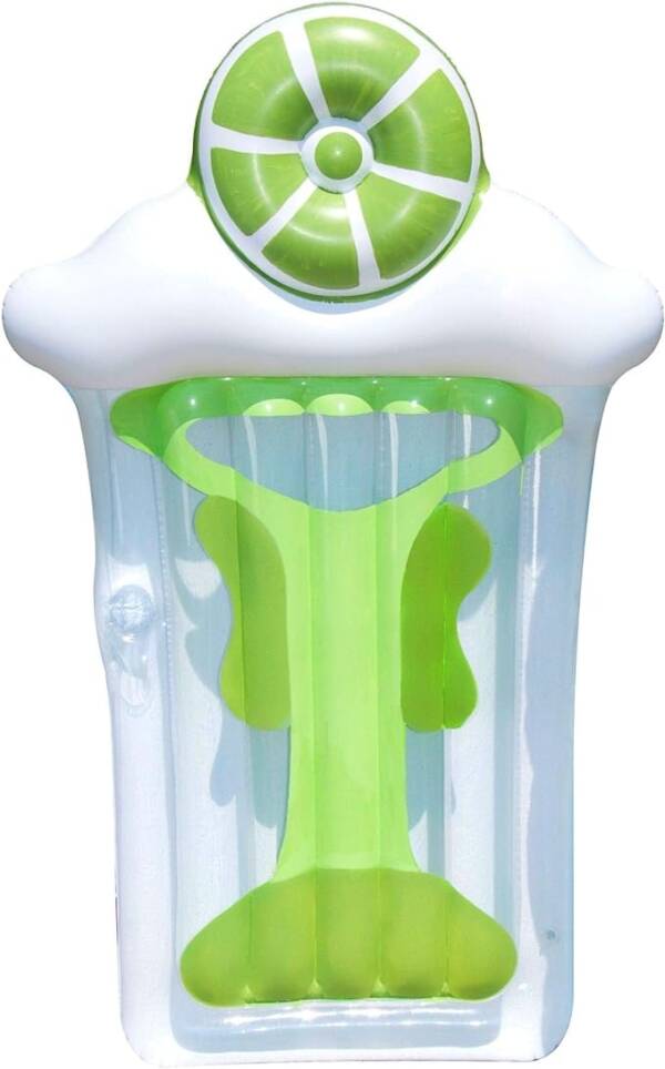 A green and white toothbrush holder with toothpaste on it.