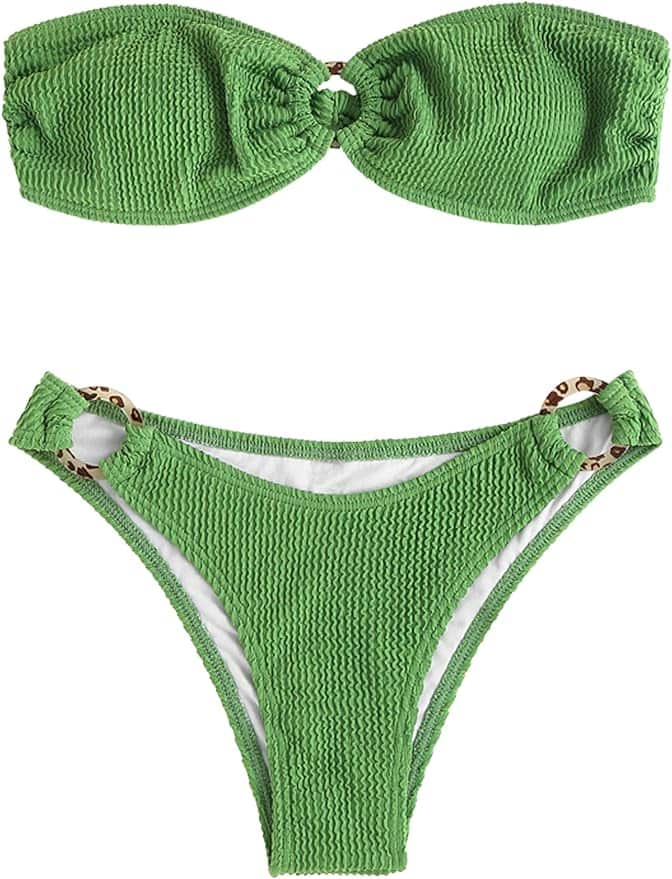 A green bikini is shown with the bottom half of it.