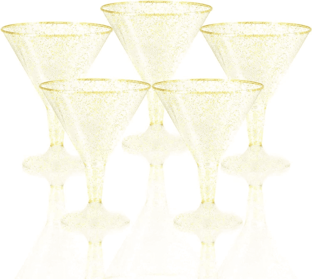 A group of six champagne glasses with gold trim.