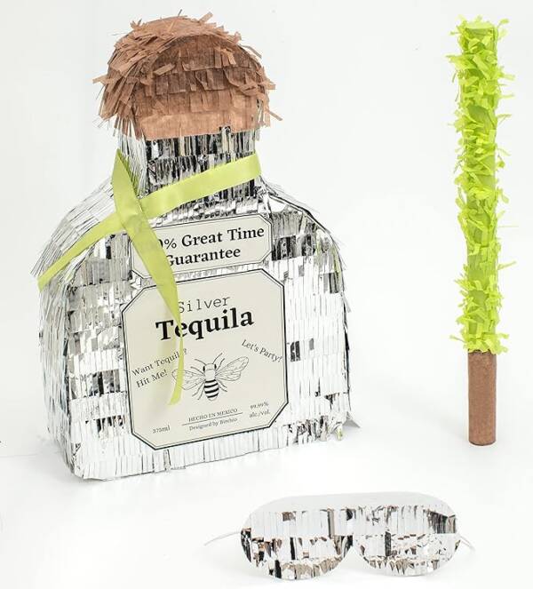 A bottle of tequila with a straw in it.