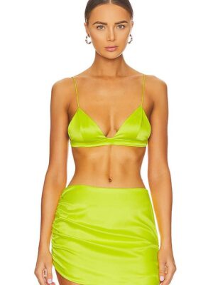 A woman in a lime green bikini top and skirt.