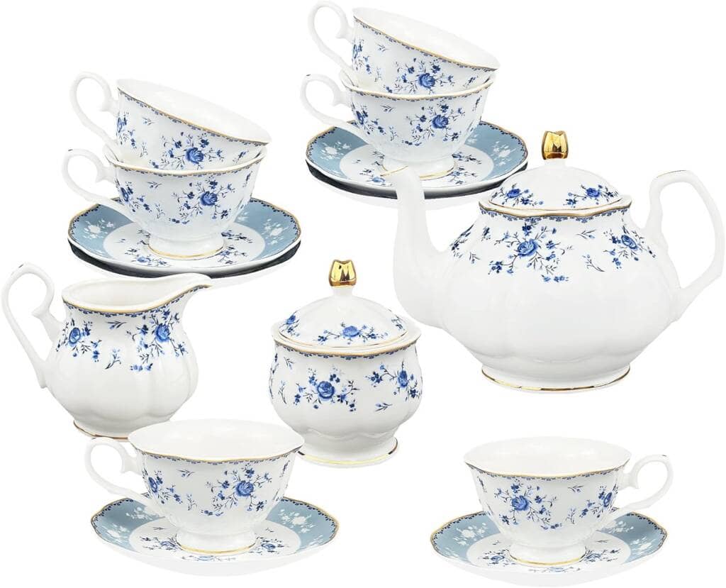 A set of tea cups and saucers with blue flowers.