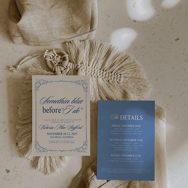 A couple of wedding invitations sitting on top of a table.