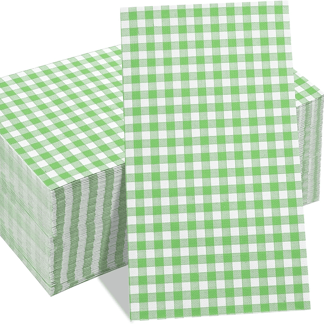 A stack of green and white paper napkins.