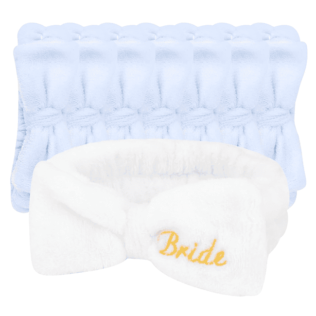 A white bow tie with the word bride embroidered on it.