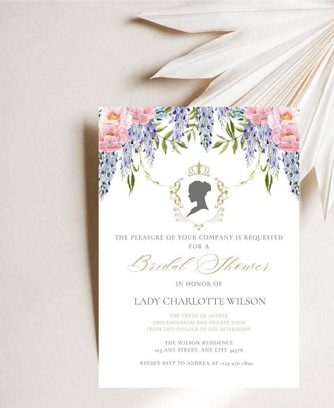 A wedding invitation with a floral design and a silhouette.