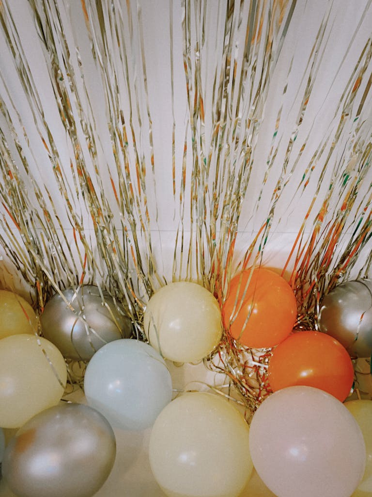 Bachelorette Fall Themes We Adore 1 Vibrant Balloons And Metallic Tinsel Backdrop For A Lively Celebration.